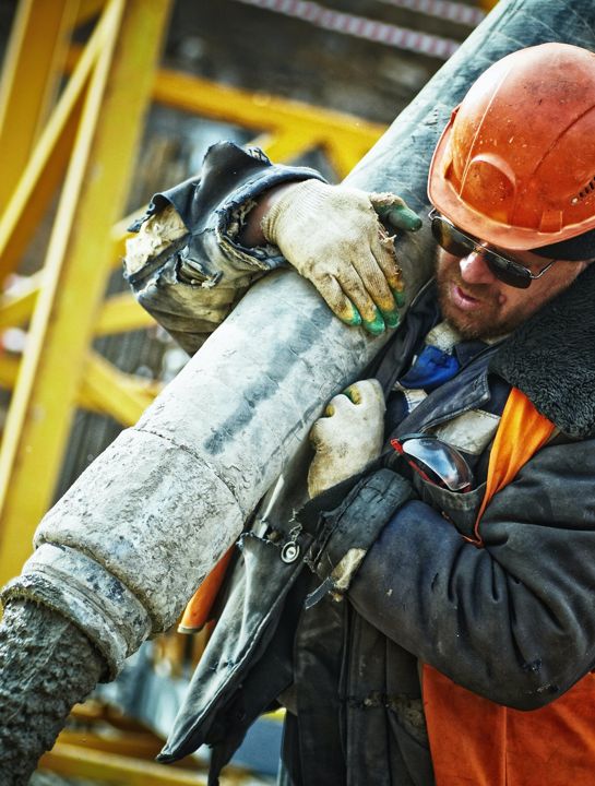 man pouring concrete