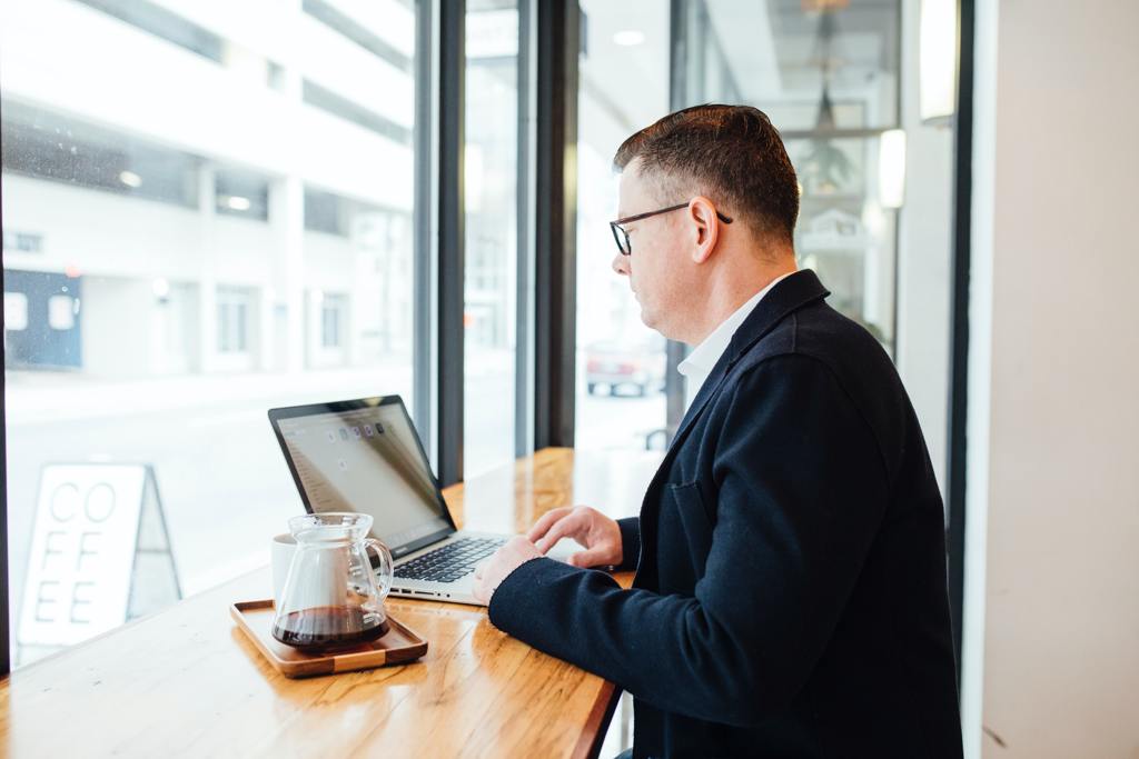 man in a suit on a computer