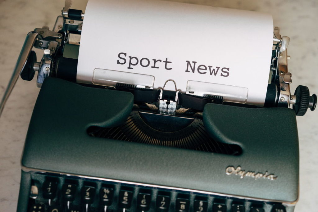 writing machine with sport news